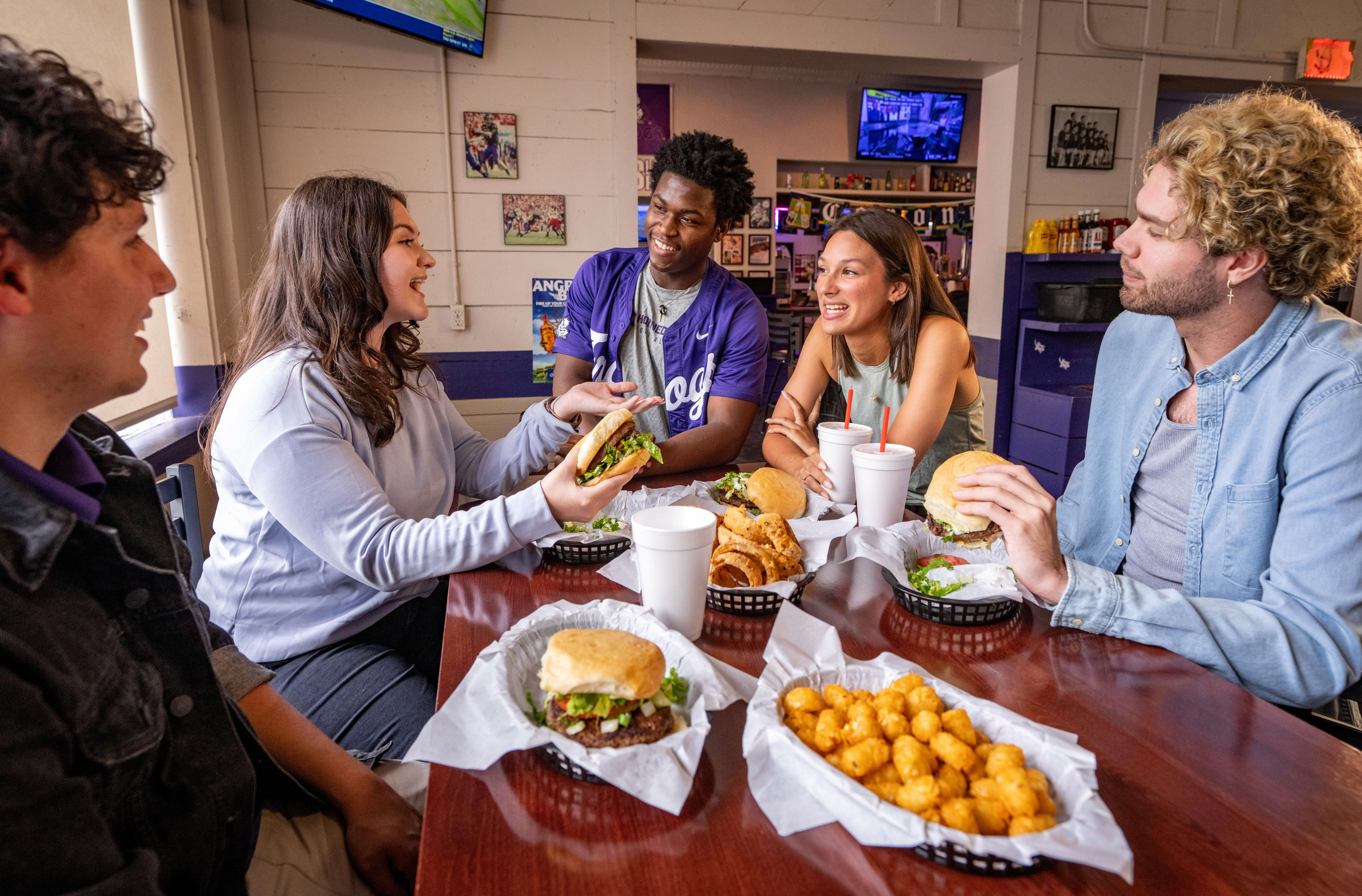TCU students enjoy time at Dutch's restaurant on Friday, May 28, 2025, in Fort Worth, Texas. Photo by Jeffrey McWhorter.