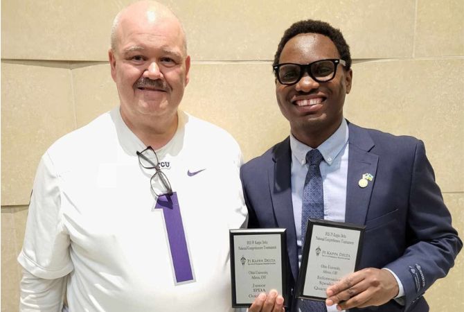 Happy Herman pictured with his coach, Professor Dan Moss