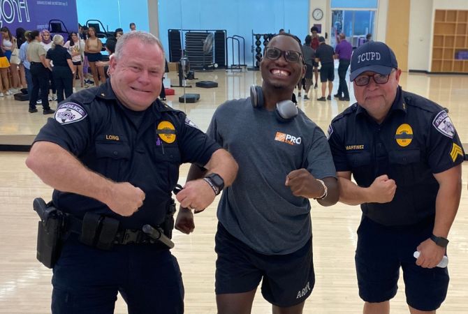 Happy Herman with TCU Police officers after a self-defense class