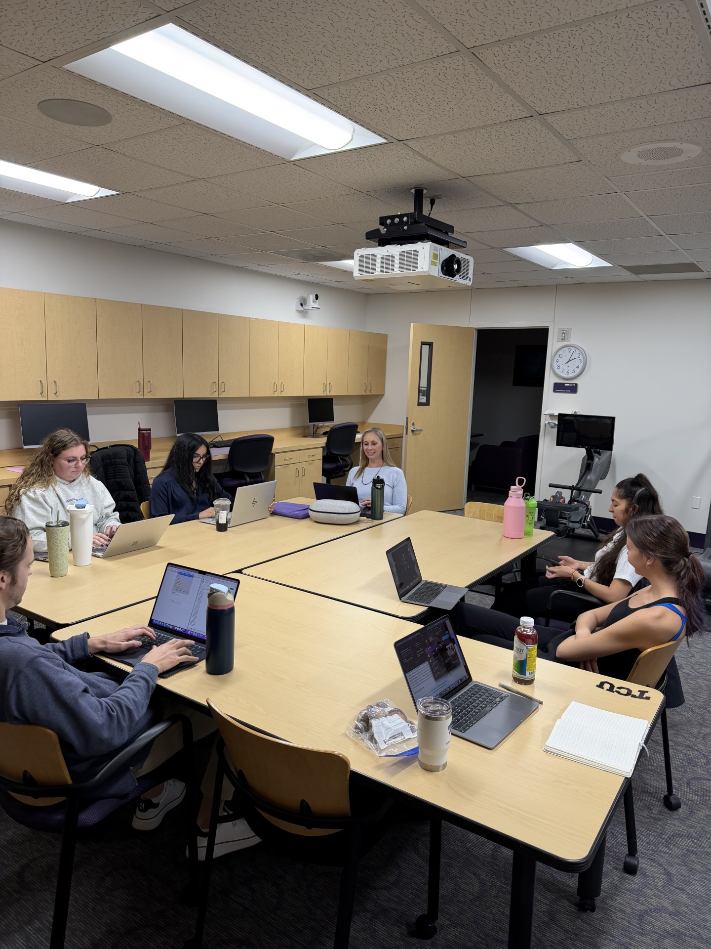 Dr. Trocchio with students at a lab meeting
