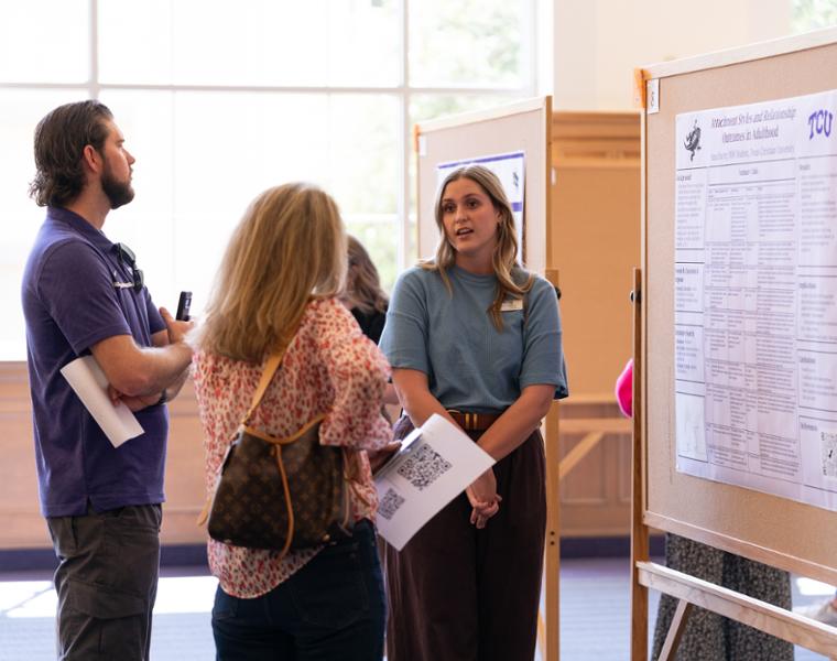 Students presenting research at showcase