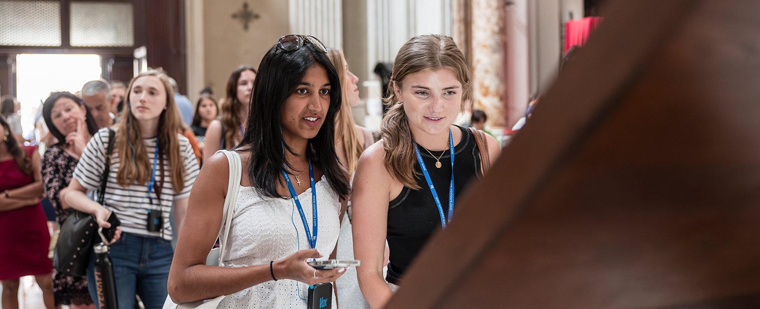 TCU female students studying abroad touring a museum 