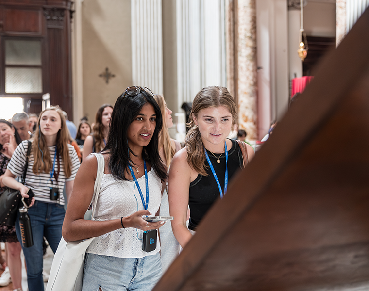 TCU female students studying abroad touring a museum 