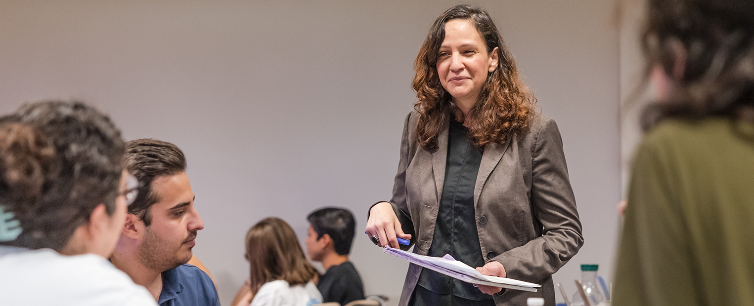 Dr. Arguello, Cinema of Latin America teaching in her classroom