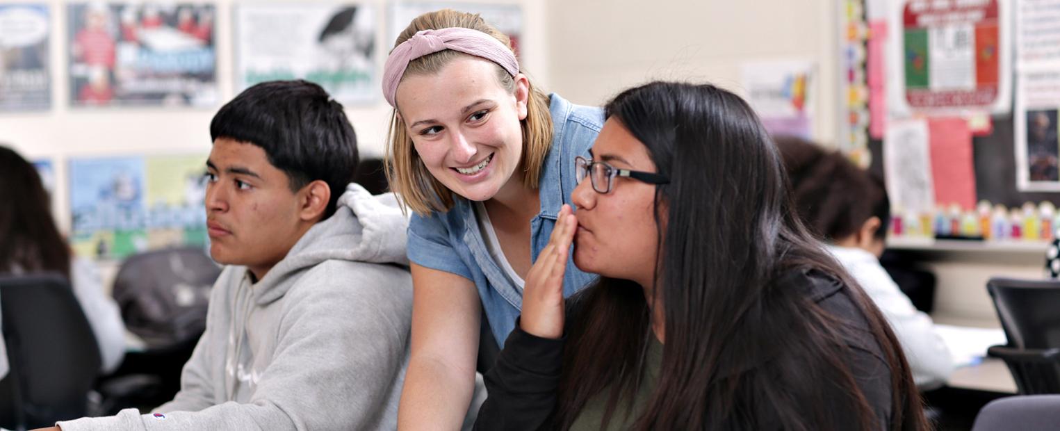 college of education student working in a classroom