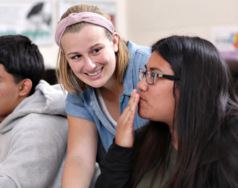 college of education student working in a classroom