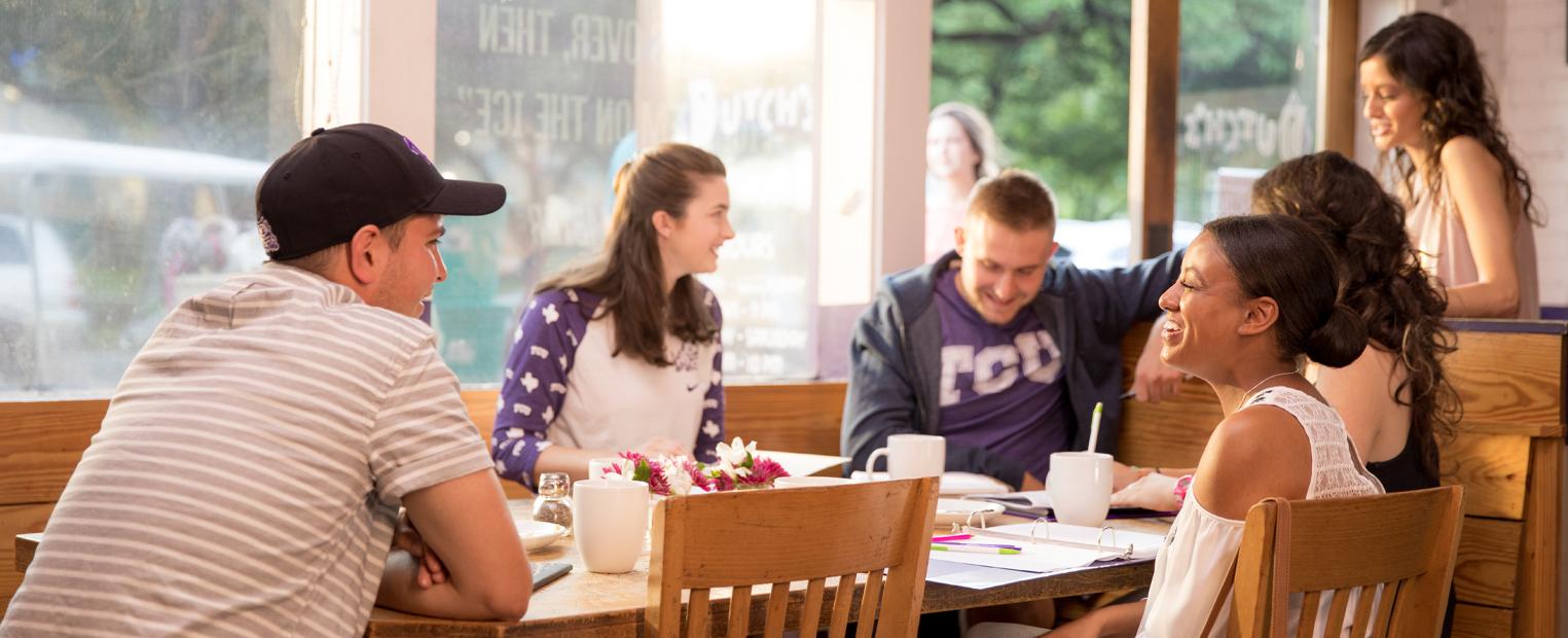 TCU students eating at Dutch's burgers near campus 