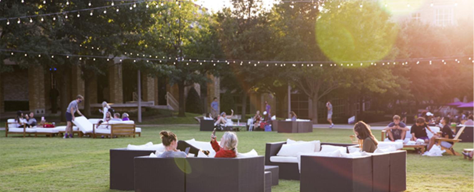 Students sitting on lounge furniture in the commons 