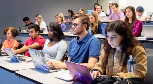 Students in a lecture using laptop computers